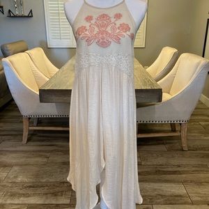 Tan/cream long dress with a halter neckline and flower pattern
